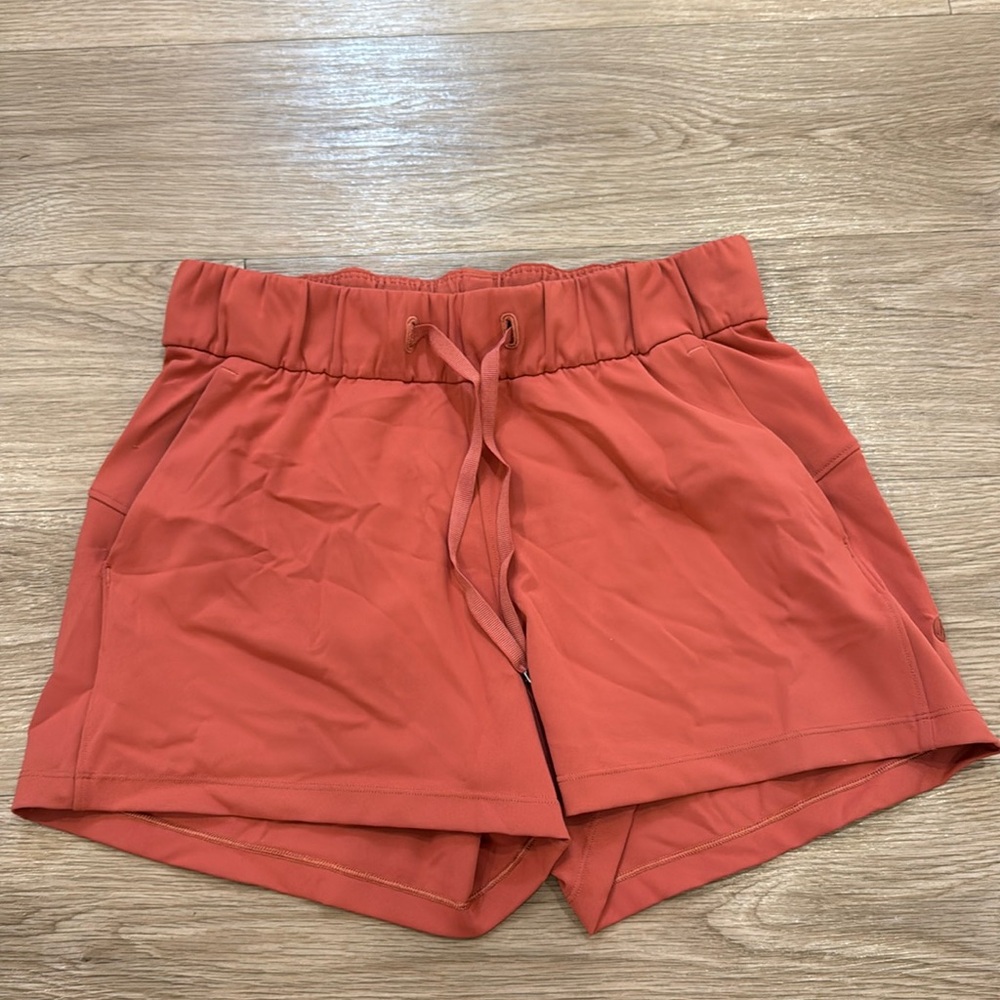 Coral-colored Lululemon shorts Size 4